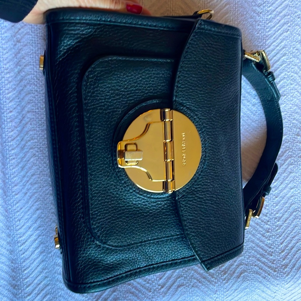 Micheal Kors black  handbag. Gold tone hardware.